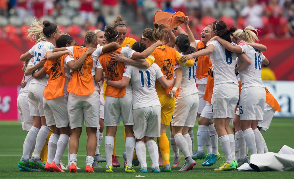 AP photo 
 England players celebrate their 2-1 win over Canada following a Women's World Cup quarterfinal game in Vancouver, British Columbia, Canada, on Saturday.