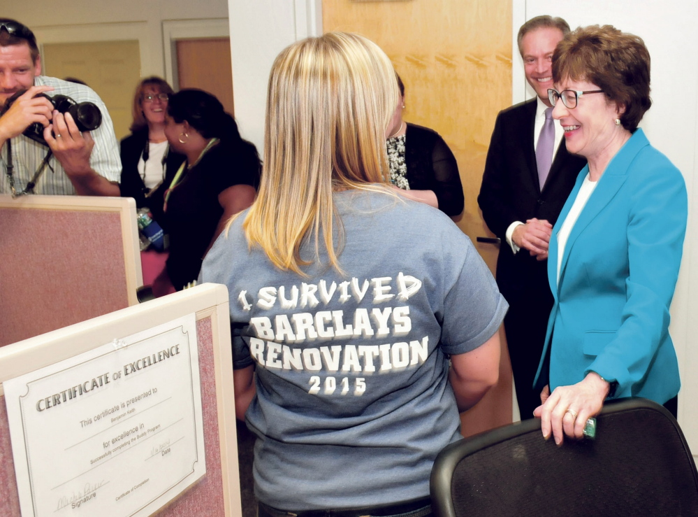 U.S. Sen. Susan Collins, R-Maine, chats with Barclaycard employee Danielle St. Germaine who was wearing a T-shirt referring to the $5 million renovation project that increased employment by 150 workers during a ribbon-cutting celebration at the Wilton company on Tuesday.