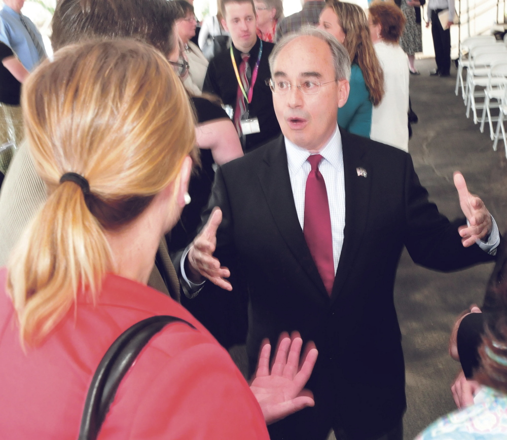 U.S. Rep. Bruce Poliquin, R-2nd District, speaks with employees during a ribbon cutting at the Barclaycard call center in Wilton on Tuesday.