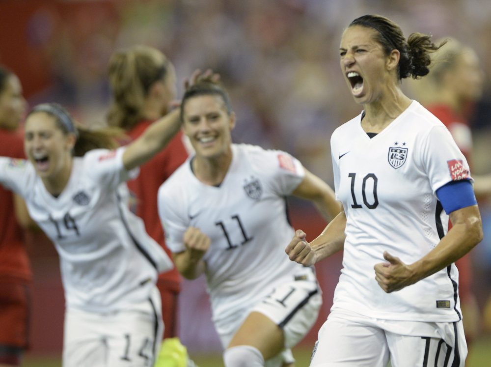 AP photo 
 United States' Carli Lloyd (10) celebrates with teammates Ali Krieger (11) and Morgan Brian after scoring on a penalty kick against Germany during the second half of a World Cup semifinal Tuesday in Montreal, Canada.
