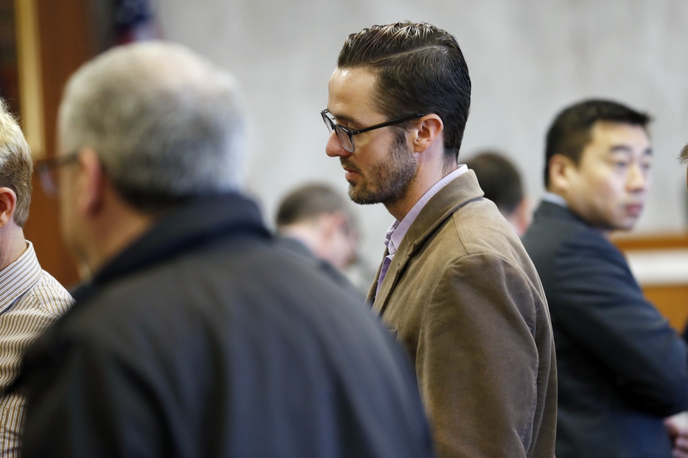 Plaintiff Michael Ferguson stands in the courtroom during a trial against Jews Offering New Alternatives for Healing, (JONAH) Wednesday, June 3, 2015, in Jersey City, N.J. The nonprofit New Jersey based group that promised to turn gays heterosexual instead offered "junk science" and lies, an attorney for four young men told jurors Wednesday during opening statements in the fraud trial involving so-called gay conversion therapy.   (Alex Remnick/The Star-Ledger via AP,  Pool)