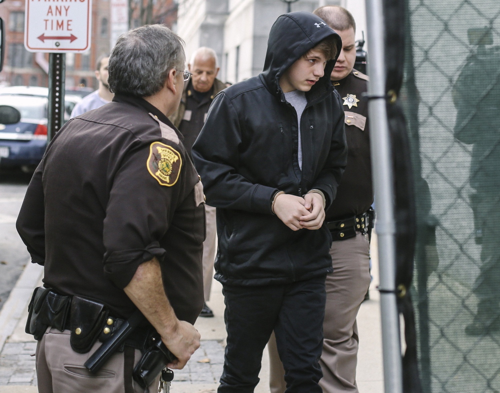 Justin Woodbury, seen arriving for his initial court appearance in December, is accused of sending threatening emails to Windham school administrators. He was held at the state’s Long Creek Youth Development Center until Thursday, when he was release to live with his parents.