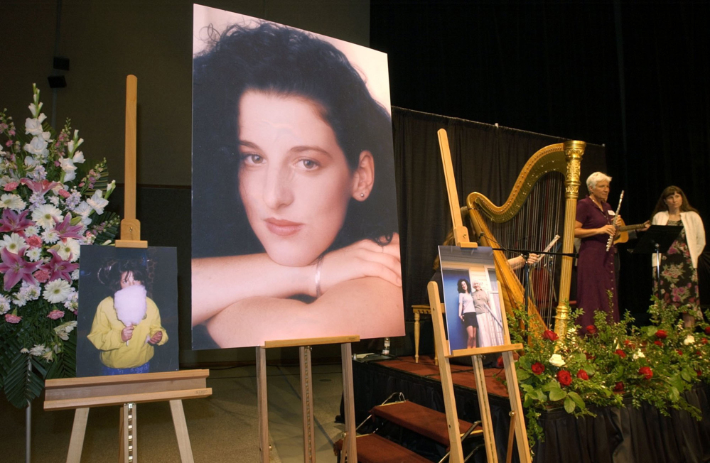 Photos of Chandra Levy are displayed in Modesto Centre Plaza in Modesto, Calif., at the 2002 memorial service for the Washington intern killed in 2001.