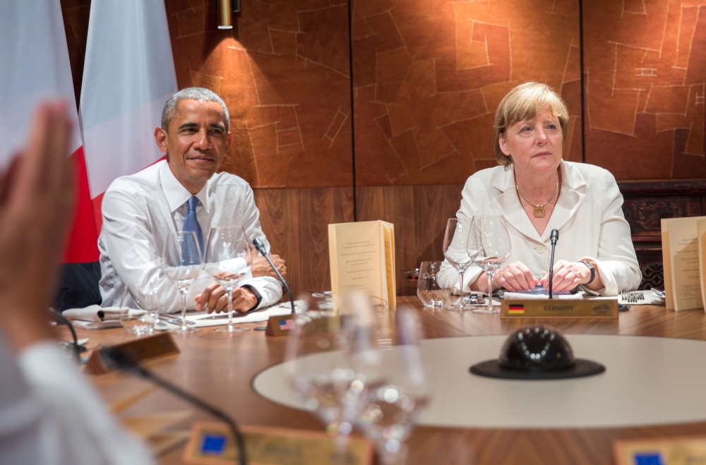 President Obama and German Chancellor Angela Merkel attend a working dinner at the G-7 summit in Elmau near Garmisch-Partenkirchen, southern Germany, on Sunday.