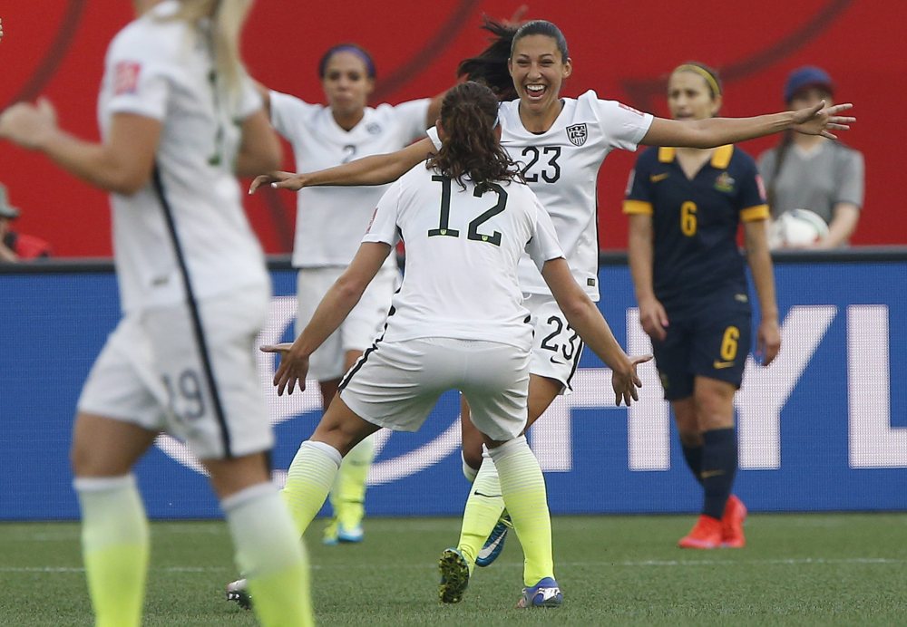 The United States’ Christen Press celebrates her tie-breaking goal against Australia with Lauren Holiday (12) during Monday’s Women’s World Cup soccer match in Winnipeg, Manitoba.