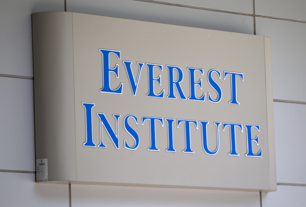 A sign for the college Everest Institute is seen on an office building in Silver Spring, Md. The system of colleges was once owned by Corinthian Colleges Inc.