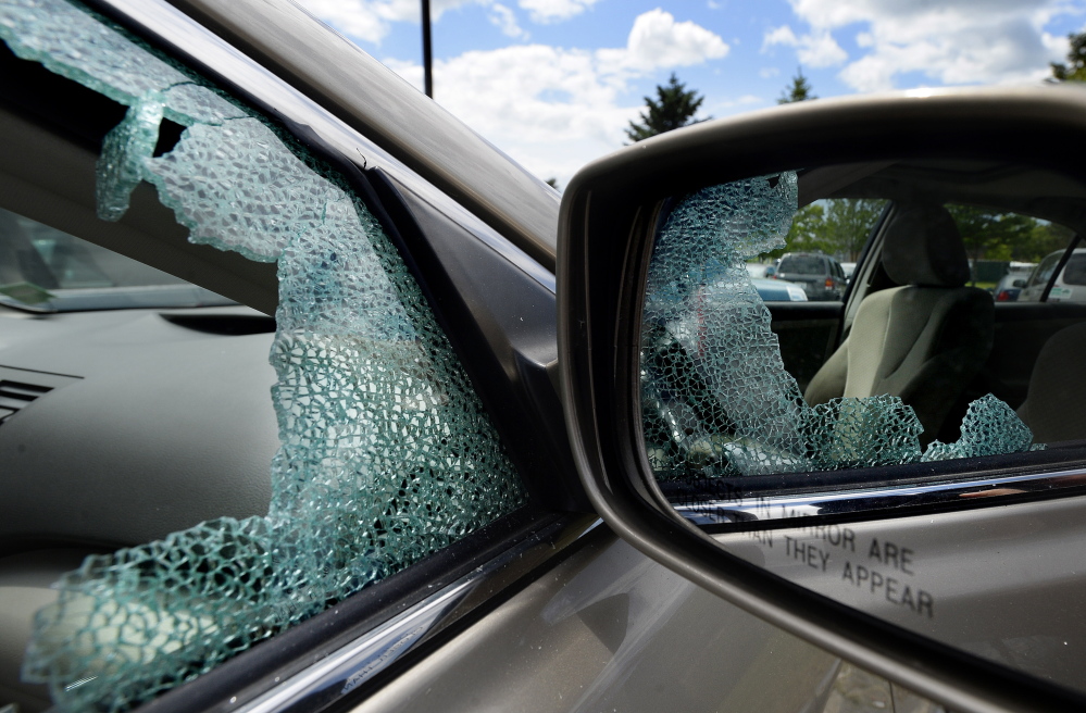 A car parked at the park-and-ride on Marginal Way in Portland on Wednesday has a broken window. There has been a string of car break-ins in the last few days in Portland.