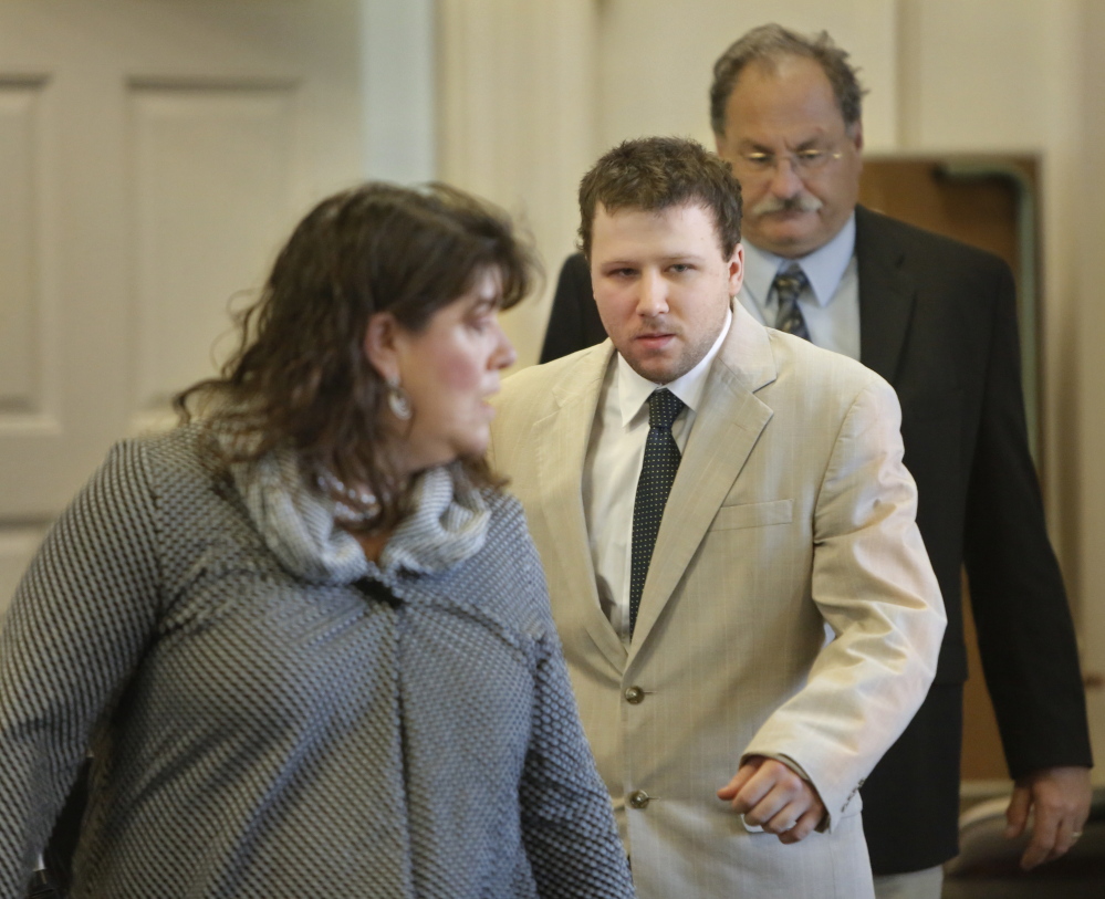 Derek Poulin follows his attorney Amy Fairfield into York County Superior Court in Alfred for the opening of his murder trial on Thursday. Poulin is accused of killing his grandmother Patricia Noel and setting her Old Orchard Beach home on fire in 2012.