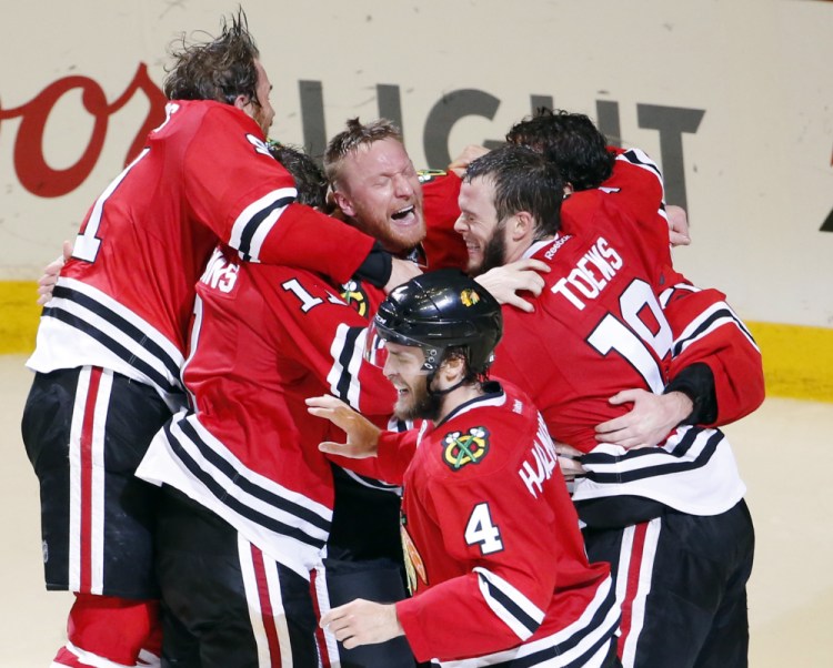 The Chicago Blackhawks celebrate a Stanley Cup championship after defeating the Tampa Bay Lightning on Monday night in Chicago. The Blackhawks defeated the Lightning 2-0 to win the series 4-2 and clinch the cup on home ice for the first time since 1938.