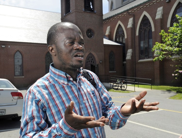 Franck Yayembe, a Portland resident who is from the Democratic Republic of the Congo, standing outside the Cathedral of the Immaculate Conception in Portland, said of the pope’s letter: “It’s a good message.”