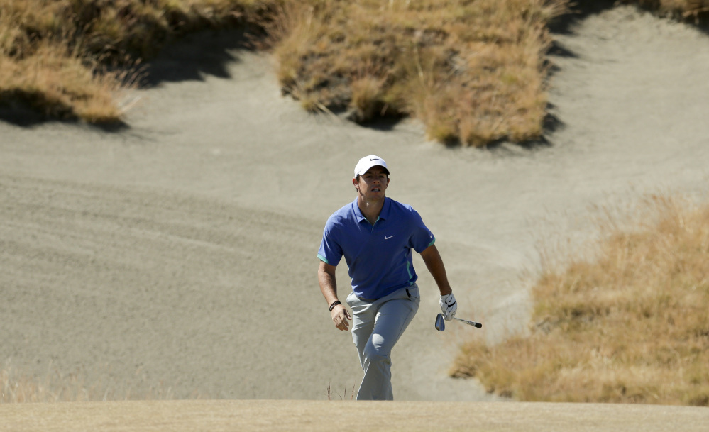 Rory McIlroy of Northern Ireland watches his bunker shot on the third hole during the third round of the U.S. Open at Chambers Bay on Saturday in University Place, Wash.
The Associated Press