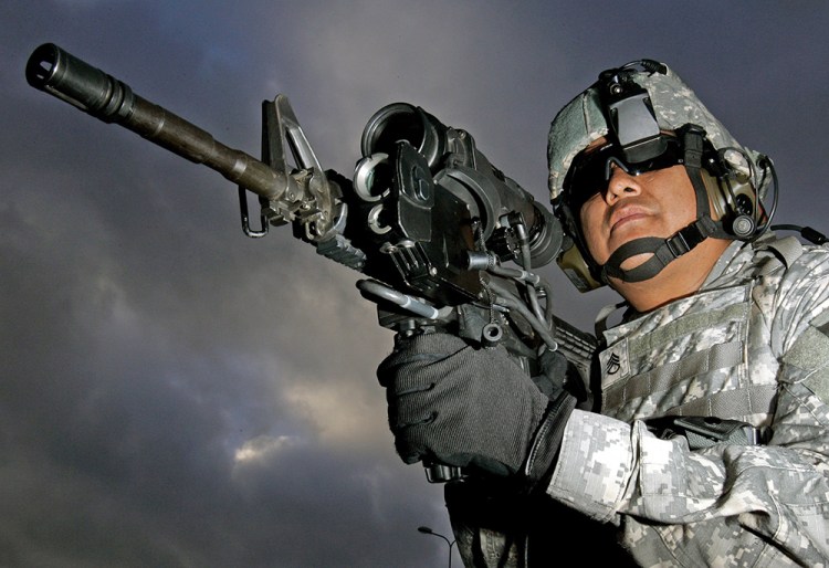 U.S. Army Staff Sgt.  Ruben Romero fires an M4 with magnifying video camera and thermal imaging in this  2006 photo.  The military has relied solely on Colt Defense of Hartford, Conn., to make the M4s. The Associated Press
