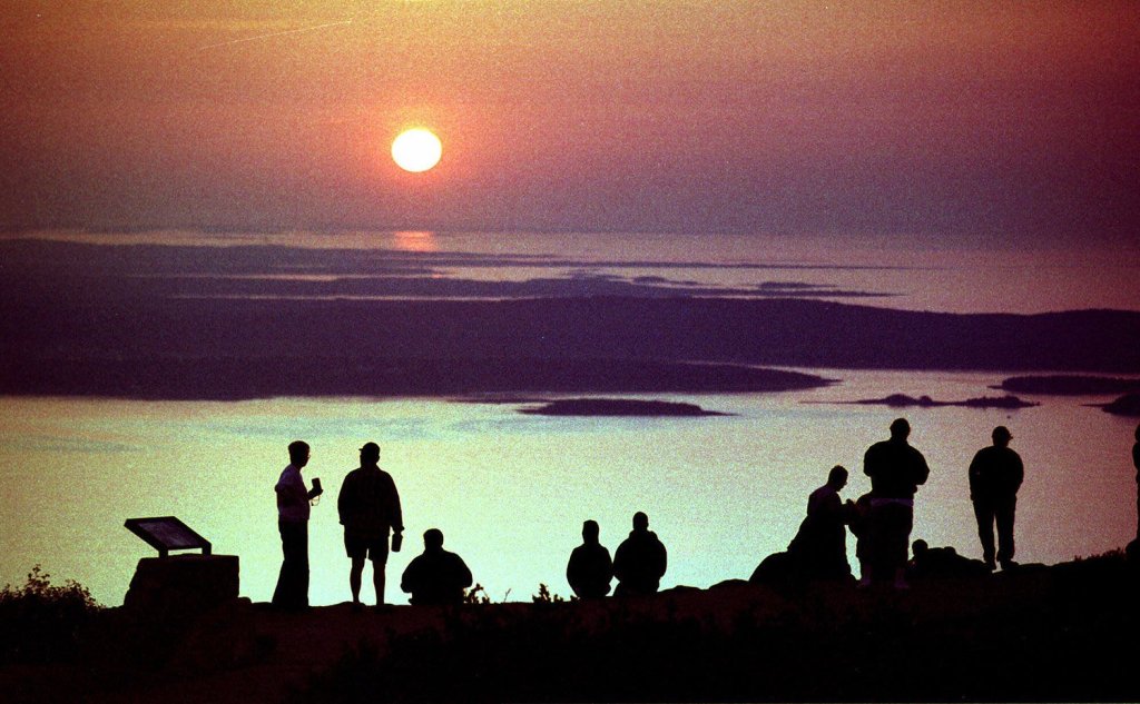For years, visitors to Acadia National Park have gathered to watch the sun rise from the summit of Cadillac Mountain near Bar Harbor.