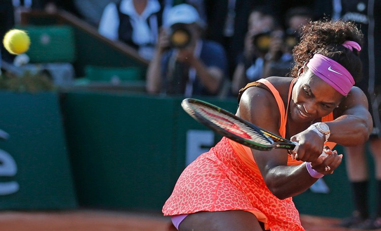 Serena Williams plays the match ball to win her semifinal match of the French Open tennis tournament against Timea Bacsinszky of Switzerland in three sets 4-6, 6-3, 6-0 Thursday. The Associated Press