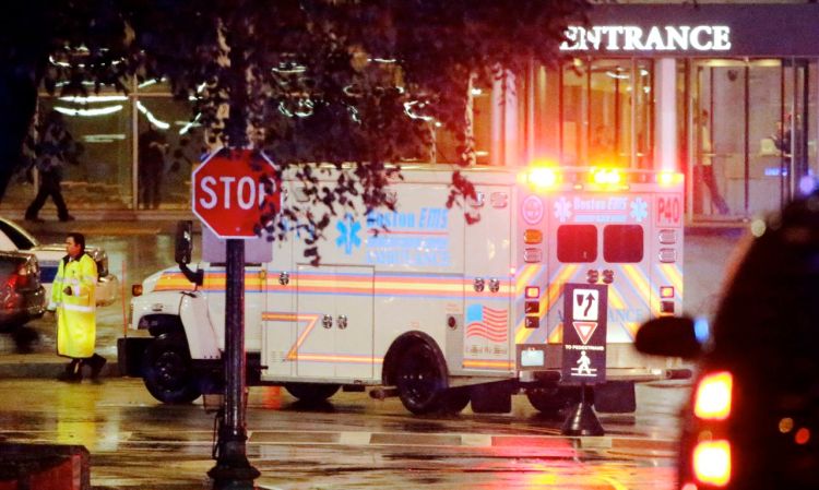 An ambulance motorcade trandporting Secretary of State John Kerry and his orthopedic surgeon arrives at Massachusetts General Hospital Monday night.
The Associated Press