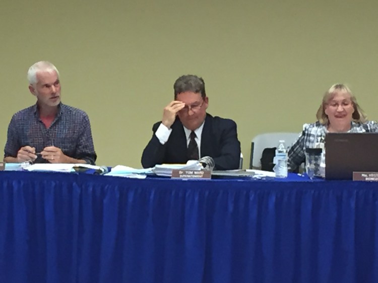 Superintendent Thomas Ward, center, hears concerns during a second long round of potential budget cuts Tuesday night.