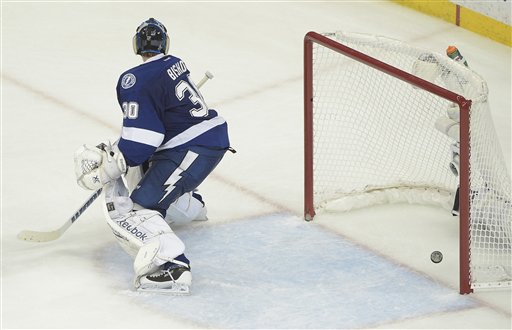 Tampa Bay Lightning goalie Ben Bishop watches as Chicago Blackhawks left wing Teuvo Teravainen scores a goal during the third period in Game 1 of the  Stanley Cup Finals in Tampa, Fla., Wednesday.  The Blackhawks defeated the Lightning 2-1. The Associated Press