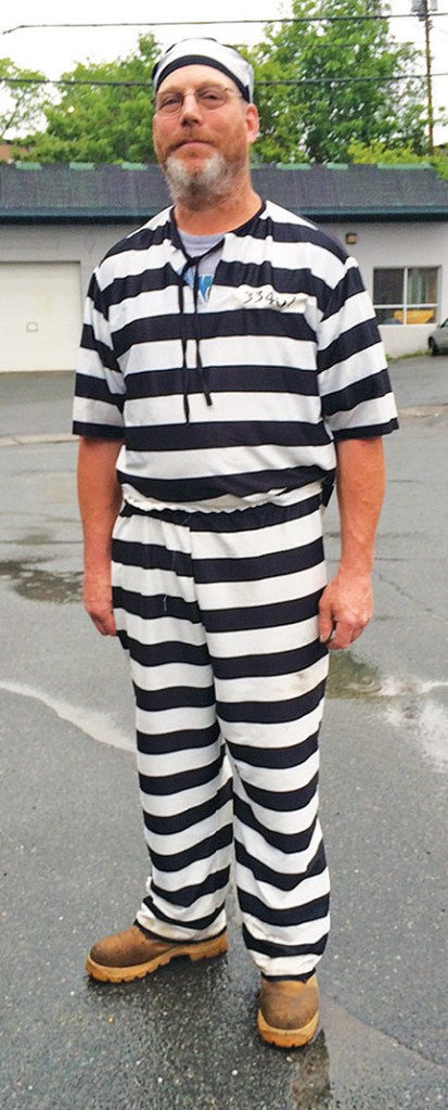 James Lowe of Barnet, Vermont, poses for a photo Tuesday after a judge  told him to leave the Caledonia County Courthouse in St. Johnsbury for wearing prison stripes and matching beanie to jury selection. Dana Gray/The Caledonian Record via AP