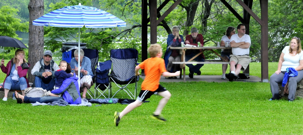 Umbrellas and shelters kept music fans dry as bands played on Wednesday at Fort Halifax Park in Winslow. It was opening day of the Winslow Family 4th of July celebration.