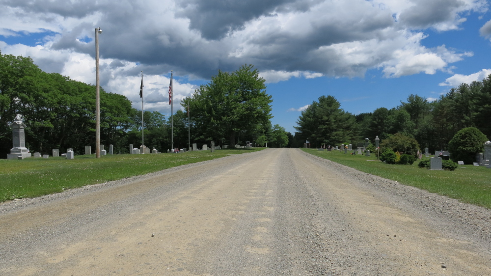 A half-mile stretch of Kanokolus Road in Unity that passes the cemetery will paved, selectmen decided Tuesday night. The gravel from the road is causing damage to Pond Cemetery.