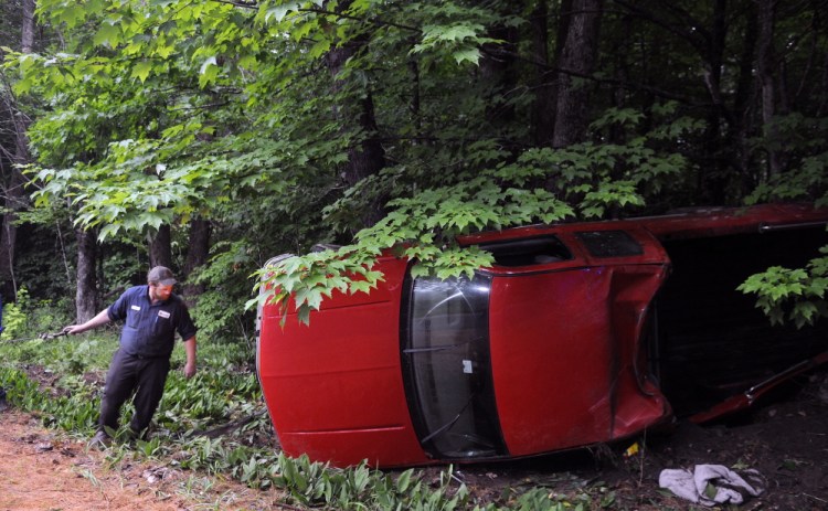A winch is attached to a pickup that struck a tree and rolled over on the Hallowell-Litchfield Road in Litchfield. Police responded to the accident at 6:25 p.m. Wednesday and discovered that the driver, the sole occupant of the vehicle, was uninjured.