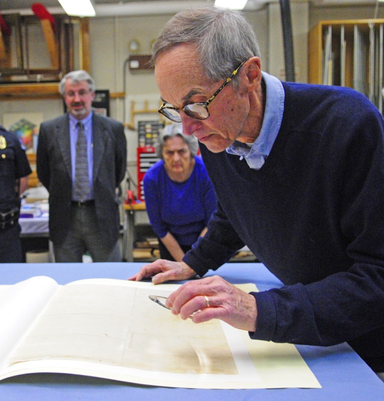 Hallowell City Historian Sam Webber looks at the writing on the back of the city’s 1776 copy of the Declaration of Independence on April 16 in the Maine State Museum in Augusta. The historic document will be on display during the Independence Day holiday in Hallowell City Hall.