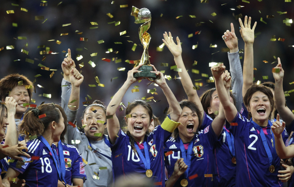 Japan players celebrate with the trophy after winning the final match against the United States at the 2011 Women’s Soccer World Cup in Frankfurt, Germany. Leading up to the victory in Germany, Japan had been deeply scarred by the deadly earthquake and tsunami. The national team gave the country reason to cheer, and the players were welcomed home as heroes.