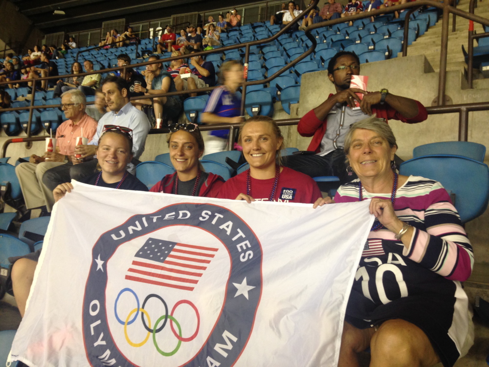Julia Clukey, second from right, sits with her friend Savannah Green, her sisterAmelia Clukey and her mother Cheryl Clukey at the United States-Germany semifinal match at the Women’s World Cup recently.