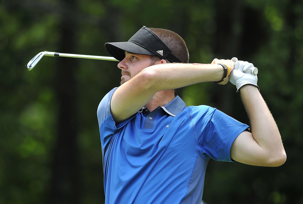 Andrew Slattery watches his tee shot on the par three, 13th hole in the final round of the 2014 Maine Amateur at the Woodlands in Falmouth. He became the eventual champion after parring out to beat Joe Walp by one.