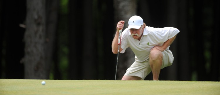 Mark Plummer eyes the green for his putt during day two of the Maine Amateur on Wednesday.
