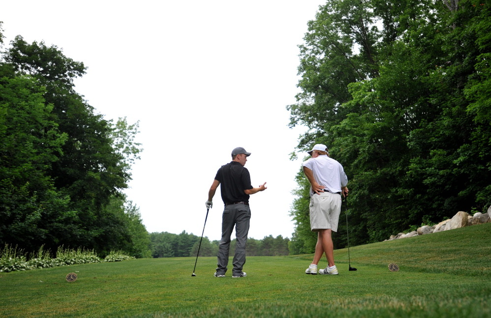 John Hayes, left, and Mark Plummer, chat while waiting to tee off on day three of the Maine Amateur at the Waterville Country Club in Oakland on Thursday.
