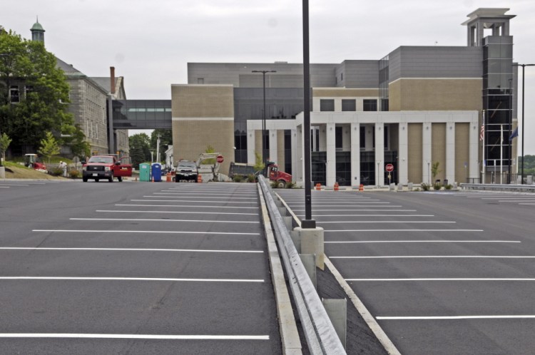 A new public parking lot in front of the Capital Judicial Center in Augusta had stripes painted on it Thursday.