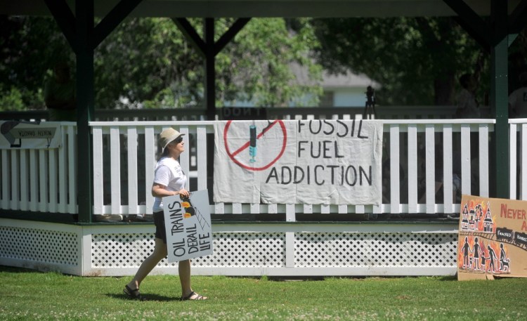 A protester arrives on Saturday at Veteran’s Memorial Park in Fairfield for a protest against oil trains.
