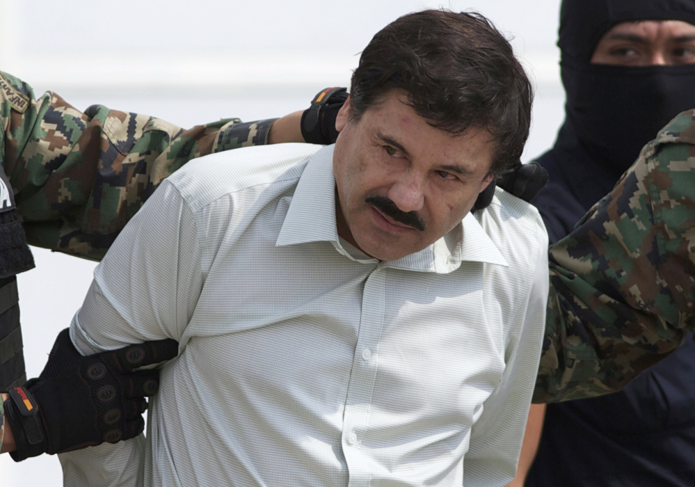 In this Feb. 22, 2014, file photo, Joaquin “El Chapo” Guzman, head of Mexico’s Sinaloa Cartel, is escorted to a helicopter in Mexico City, following his capture overnight in the beach resort town of Mazatlan.