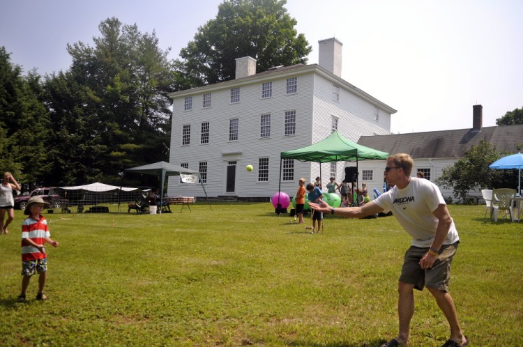 People play on the lawn of Pownalborough Court House during Dresden Summerfest on Sunday.