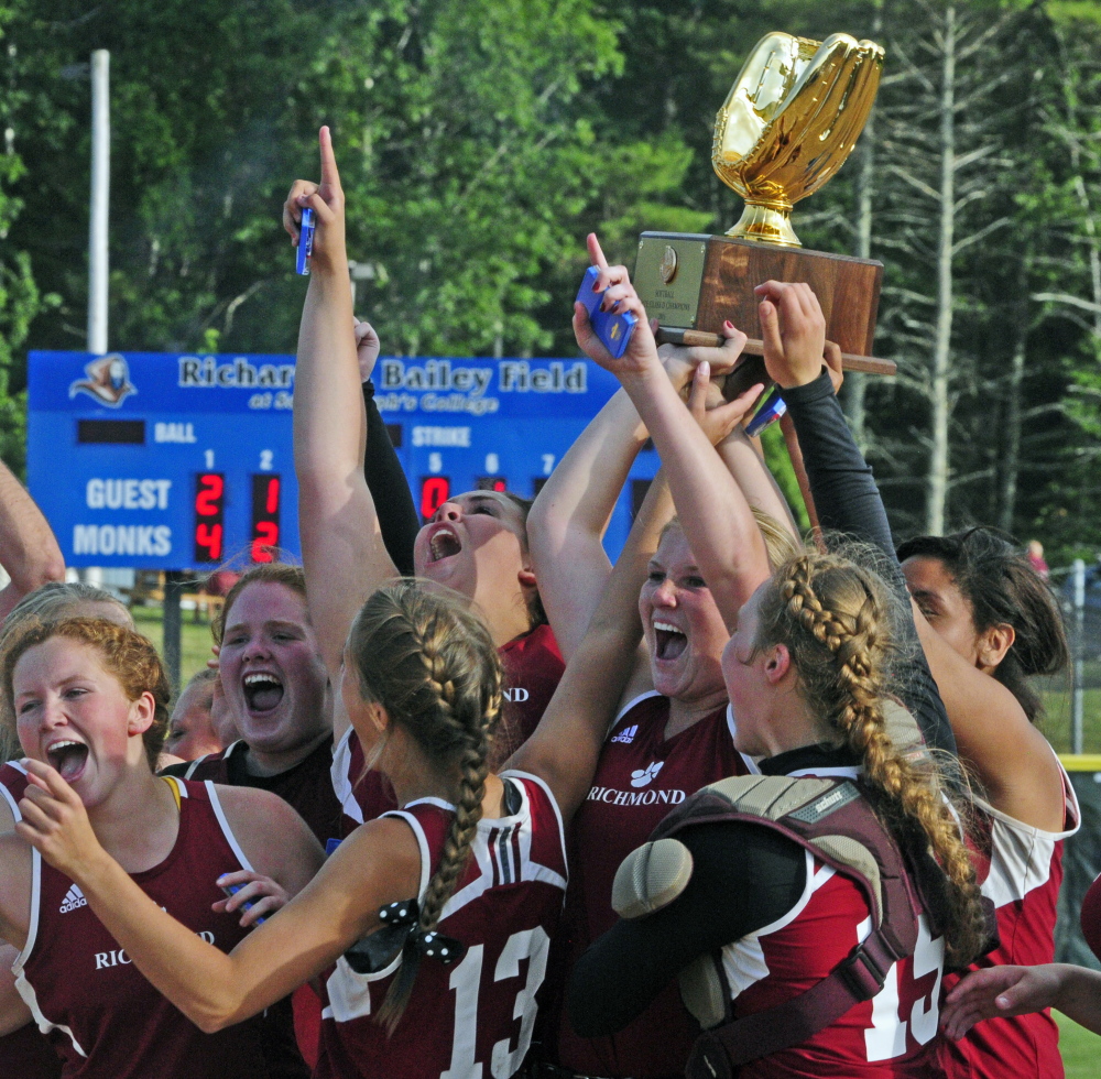 Staff photo by Joe Phelan
The Richmond softball team celebrates after winning the Class D state championship last month at St. Joseph’s College in Standish. MaxPreps named the Bobcats its Small Schools Softball Team of the Year.