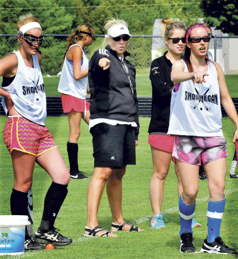 Staff file photo by David Leaming 
 Skowhegan Area High School field hockey coach Paula Doughty, center, directs her team during a drill on the opening day of fall sports last August. Doughty and the Indians will participate in the annual Battle for Breast Cancer TYournament on Saturday at Thomas College.