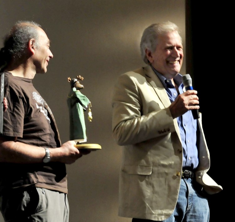 Actor and Maine International Film Festival Mid-Life Achievement Award winner Michael Murphy, right, laughs on Thursday at the sight of the moose trophy he received from MIFF programmer Ken Eisen.
