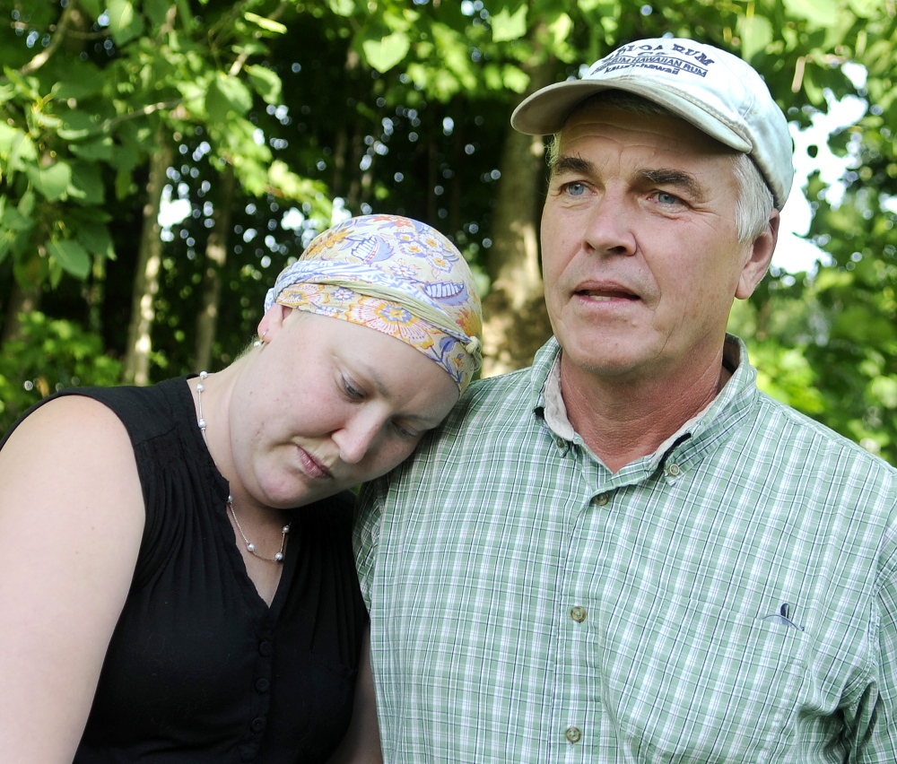 Heather Black and her father, Gregory Black, at the latter’s home in Wayne on Wednesday. Heather Black has won her struggle to obtain health insurance coverage of her treatment for breast cancer.
