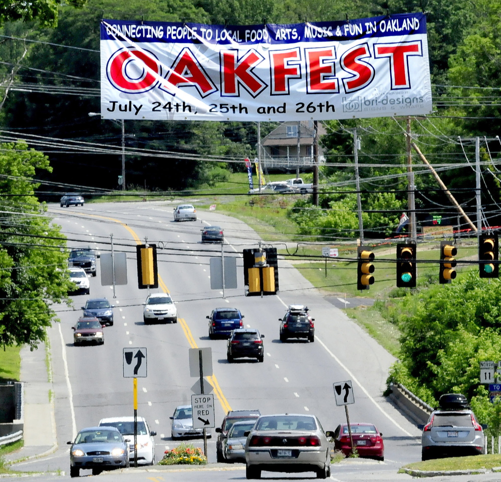 Motorists are greeted by a large banner in Oakland promoting OakFest, a new town festival that will begin Friday and run through the weekend.