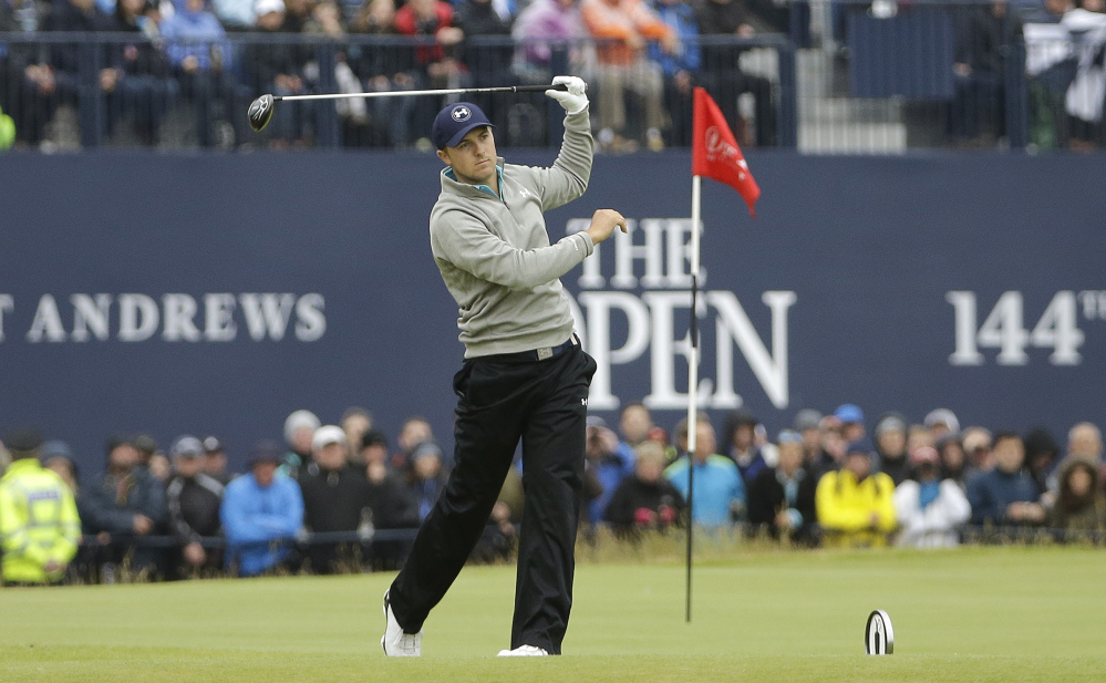 AP photo 
 Jordan Spieth makes a wayward drive from the 18th tee during the final round Monday at the British Open at the Old Course, St. Andrews, Scotland.