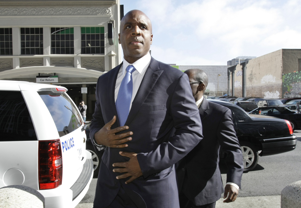 AP photo 
 In this Thursday, June 23, 2011, file photo, former San Francisco Giants slugger Barry Bonds arrives for a hearing about his perjury trial at the federal courthouse in San Francisco. The U.S. Department of Justice formally dropped its criminal prosecution of Barry Bonds, Major League Baseball's career home run leader.