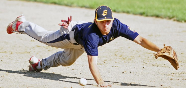 Staff photo by Joe Phelan 
 Augusta second baseman Justin Rodrigue dives but just misses a line drive by Gardiner's Eli Fish during a Zone 2 American Legion quarterfinal game Tuesday at Oak Hill High School in Wales. Augusta won 5-4.