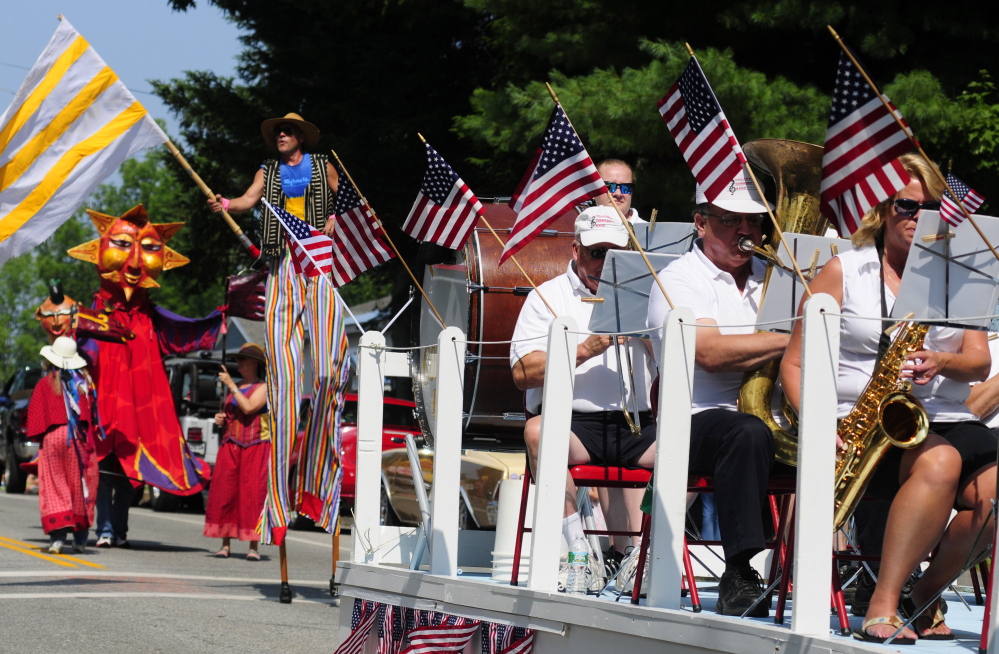 The Shoe String Theater group, left, follows the Hallowell Community Band as the annual Richmond Days parade heads down Main Street toward the Kennebec River in this 2014 file photo.