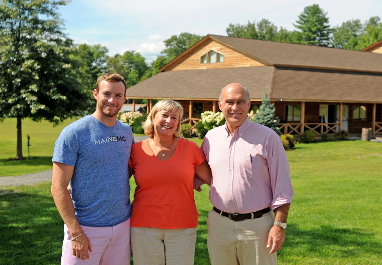 John and Kim Wiggin stand with their son Matthew at the New England Music Camp in Sidney on Aug. 20, 2014.