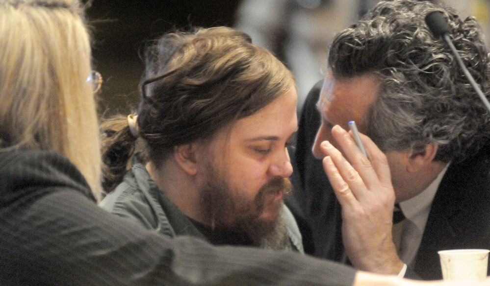 Eric Bard speaks to his attorneys, Gina Yamartino, left, and Ronald Bourget, during a hearing at Kennebec County Superior Court in January in Augusta.