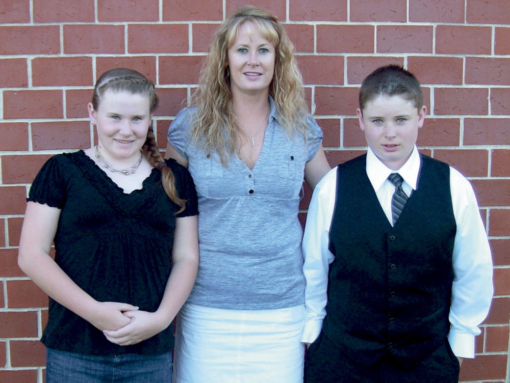 Amy Lake, with her two children, Monica and Coty, who were all killed in June 2011.