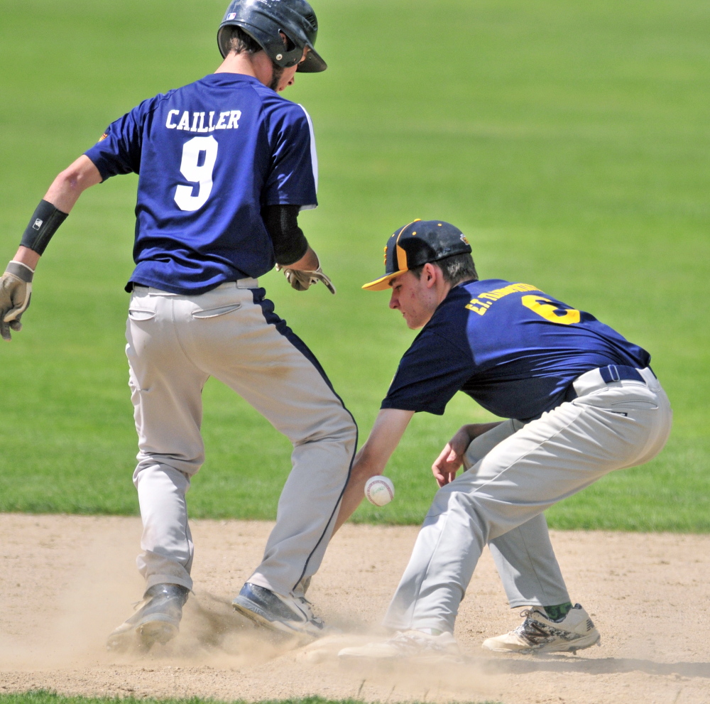 Staff photo by Joe Phelan 
 Tri-Town base runner Ethan Cailler, left, gets back to second base as the ball gets past Kolbe Merfeld during an America Legion Zone 2 tournament game Friday at Morton Field in Augusta.