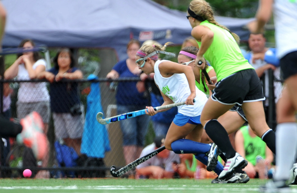 Staff photo by Michael G. Seamans 
Falmouth High School’s Elle Fitzgerald, middle, leads the pack in pursuit of a loose ball during the all-star game Saturday at the Maine Field Hockey Festival at Thomas College. The West prevailed 2-1. 