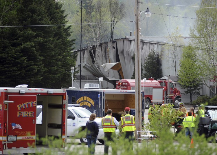 In this May 14, 2010, photo, rescue vehicles stand outside the Black Mag gunpowder plant after an explosion at the plant killed two people in Colebrook, N.H. The owner of the plant, Craig Sanborn, 64, of Maidstone, Vt., was convicted of negligent homicide on Oct. 23, 2013. In June 2015, the New Hampshire Supreme Court heard arguments appealing Sanborn’s conviction. David Oldham, a key witness whose testimony helped convict Sanborn, was shot dead in a home invasion in July 2015.
